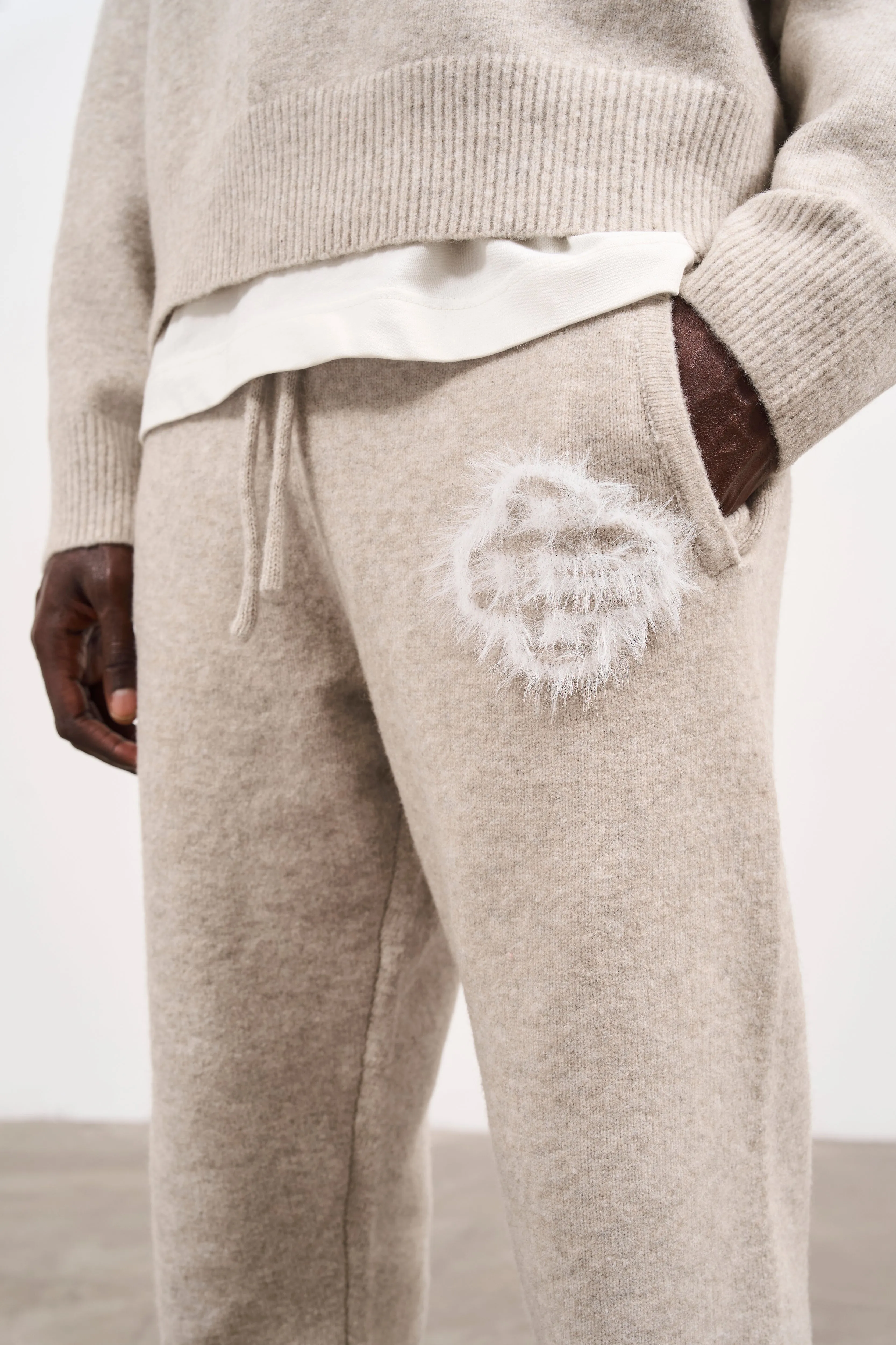 FLUFFY EMBLEM KNITTED JOGGERS - BEIGE